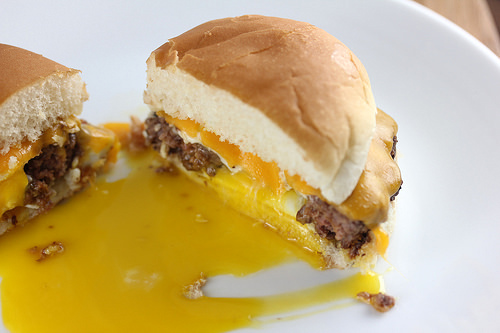 Egg in a hole burger with melted cheddar and runny yolk