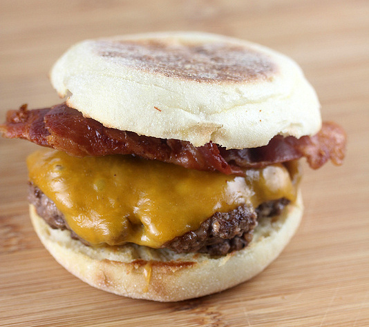 Irish burger with cheddar cheese and bacon on an English muffin