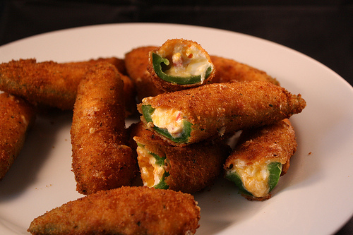 Close-up of crispy jalapeño poppers with melted cheese