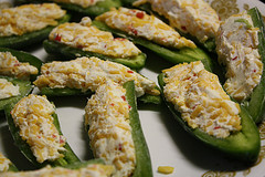 Halved jalapeños stuffed with cheese filling