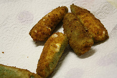 Breaded jalapeño poppers on a paper towel