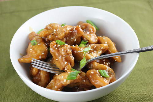 Oyster sauce chicken topped with sesame seeds and green onions