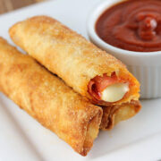 Fried pizza sticks with melted cheese and marinara sauce