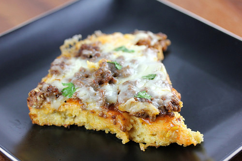 Single slice of tamale pie on a black plate