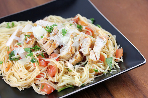 Grilled chicken bruschetta pasta with tomatoes and parmesan