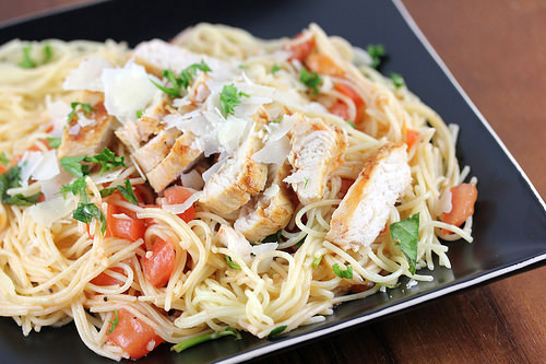 Grilled chicken bruschetta pasta with tomatoes and parmesan