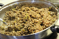 Skillet of cooked ground beef with beans and green peppers