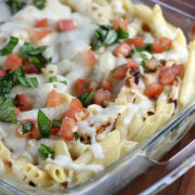 Cheesy chicken penne topped with tomatoes