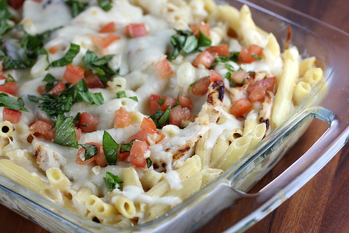Cheesy chicken penne topped with tomatoes