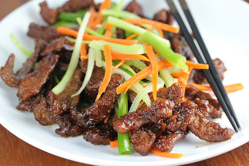 Plate of crispy Sichuan beef with vegetables