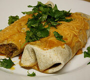 Cheesy beef burrito on plate