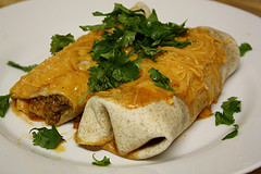 Cheesy beef burrito on plate