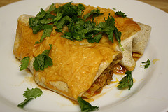 Cheesy beef burrito on plate
