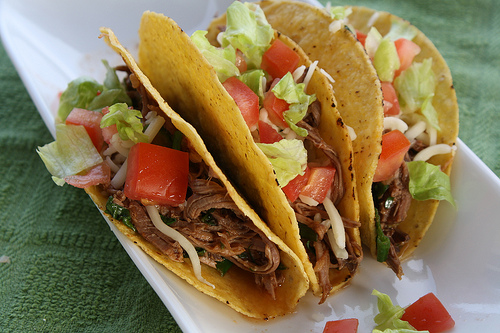 Beef tacos on a white plate