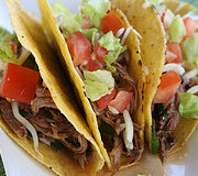 Hard shell tacos with beef and lettuce