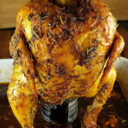 Roasted beer can chicken on a pan