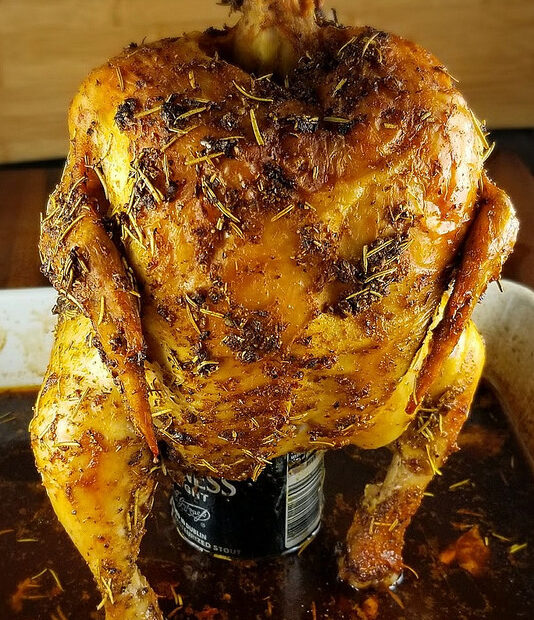 Roasted beer can chicken on a pan