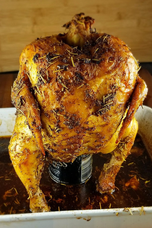 Roasted beer can chicken on a pan