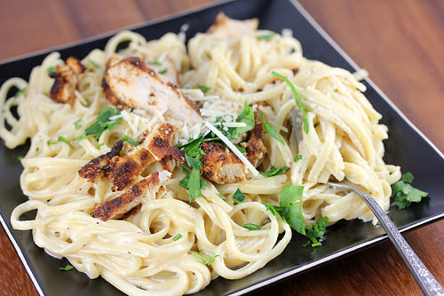 Creamy Alfredo pasta topped with blackened chicken
