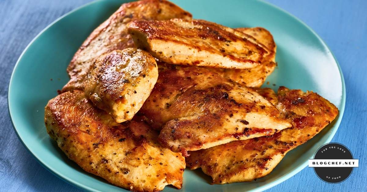 Unbreaded seasoned chicken tenderloins on a plate