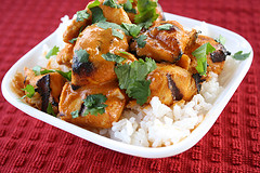 Saucy grilled chicken chunks over white rice topped with fresh cilantro