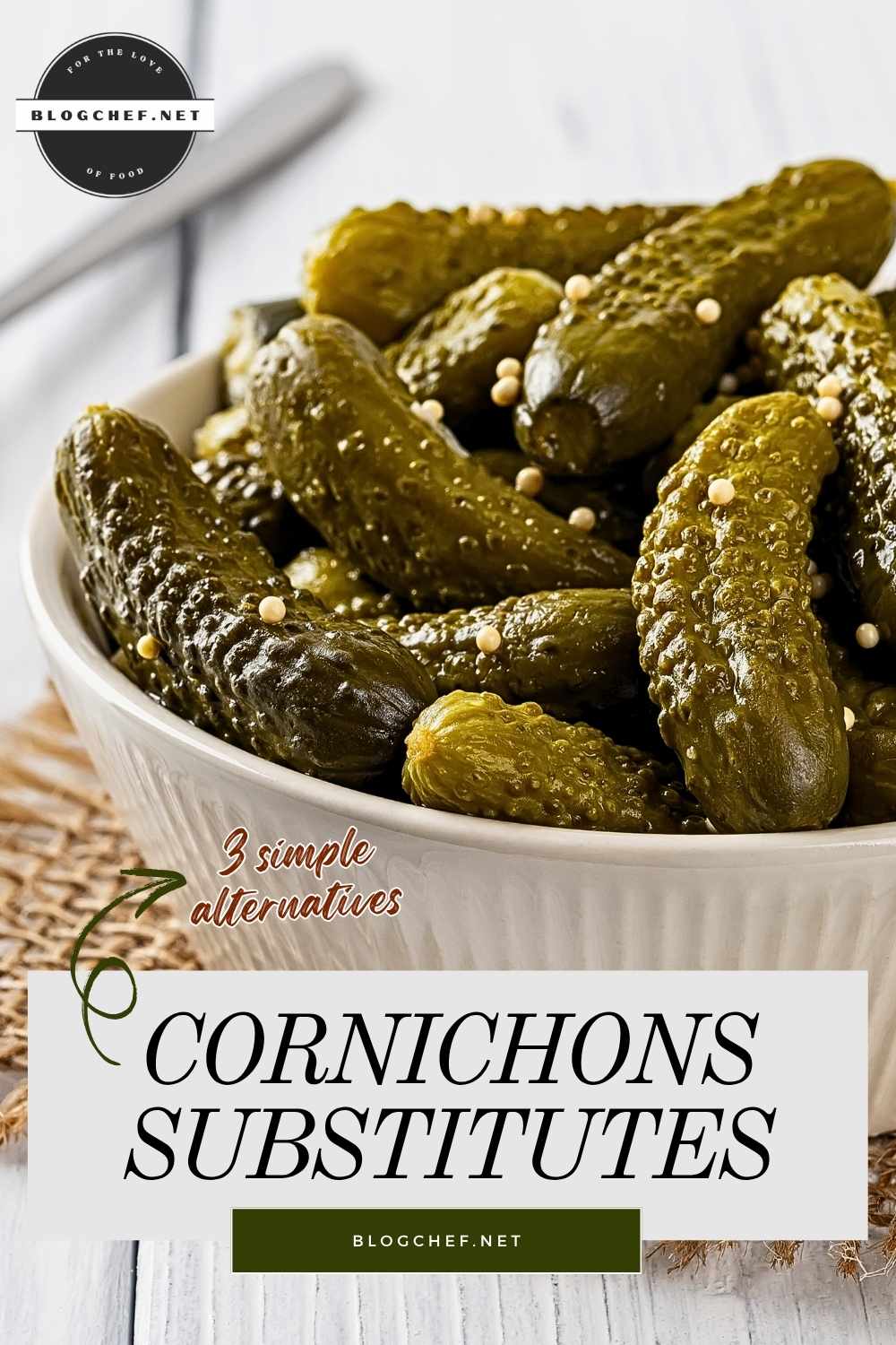 Bowl of cornichons on a wooden surface