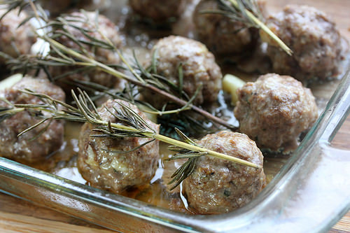 Roasted garlic meatballs in baking dish