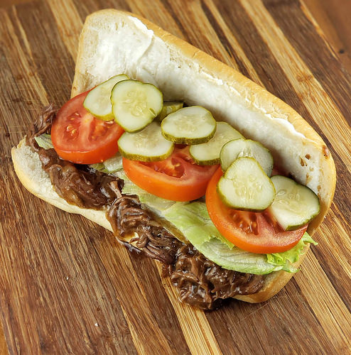 Shredded beef po’ boy on bread