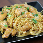 Chicken noodles topped with sesame and green onions