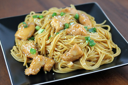 Chicken noodles topped with sesame and green onions