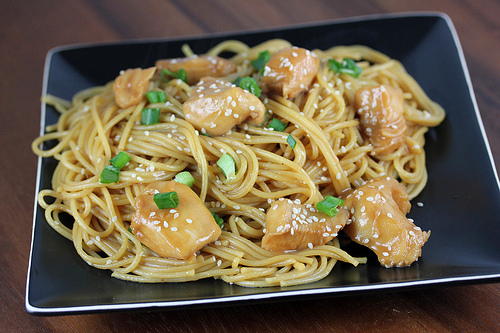 Chicken noodles topped with sesame and green onions