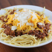Cincinnati chili served over spaghetti with cheese and onions