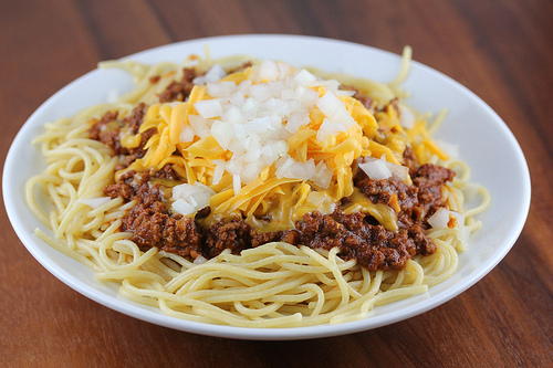 Cincinnati chili served over spaghetti with cheese and onions