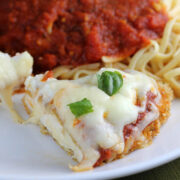 Italian baked chicken topped with melted cheese and marinara served with spaghetti