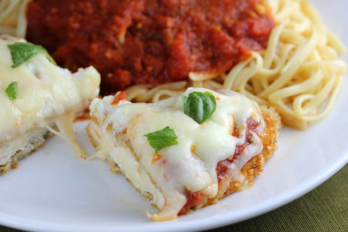 Italian baked chicken topped with melted cheese and marinara served with spaghetti