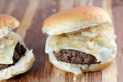 Close up of grilled onion cheddar burger slider
