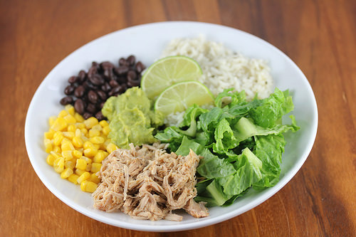 Carnitas burrito bowl with rice and veggies