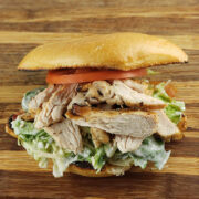 Chicken caesar sandwich with tomato slices