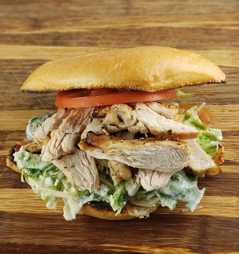 Chicken caesar sandwich with tomato slices