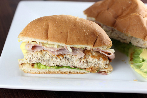 Sliced chicken cordon bleu burger with ham and melted cheese