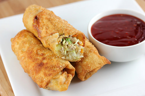 Chicken egg rolls served with dipping sauce