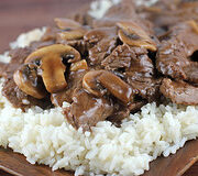 Beef and mushrooms served over white rice