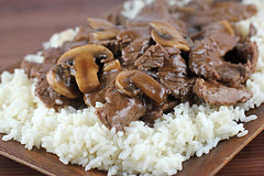 Beef and mushrooms served over white rice