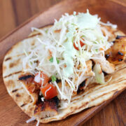 Chipotle chicken tacos loaded with fresh cabbage and tomato slaw