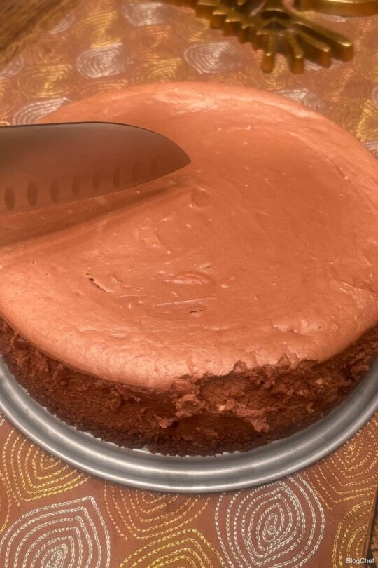 slice of chocolate cheesecake on white plate 