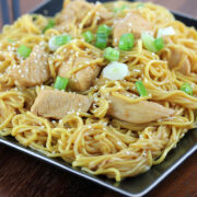 Chicken chow mein served on a black plate
