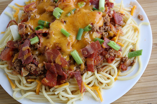 Close-up of cheesy cowboy spaghetti with bacon