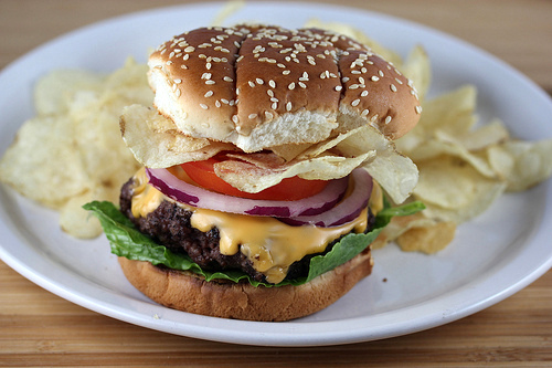 Crunchburger stacked with chips and cheese on a bun