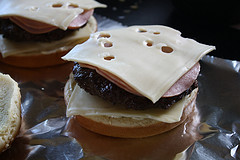 Cuban burger patty topped with cheese on bun
