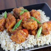 Sweet and savory chicken over rice garnished with scallions